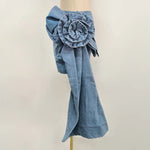 High-waist blue denim mini skirt with 3D flower design and asymmetric drape – women’s streetwear fashion