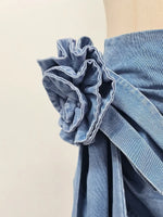 High-waist blue denim mini skirt with 3D flower design and asymmetric drape – women’s streetwear fashion