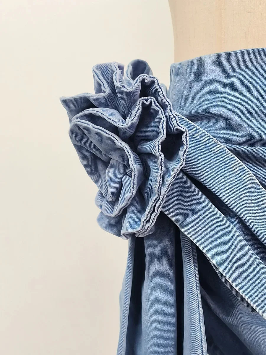 High-waist blue denim mini skirt with 3D flower design and asymmetric drape – women’s streetwear fashion
