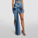 High-waist blue denim mini skirt with 3D flower design and asymmetric drape – women’s streetwear fashion