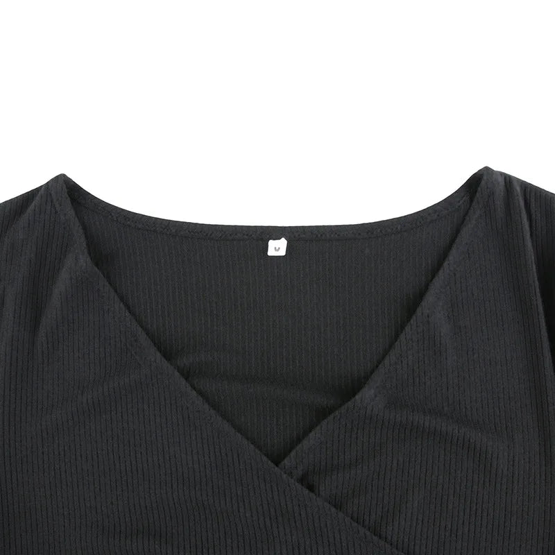 Black ribbed knit long sleeve V-neck bodycon mini dress with ruffle hem