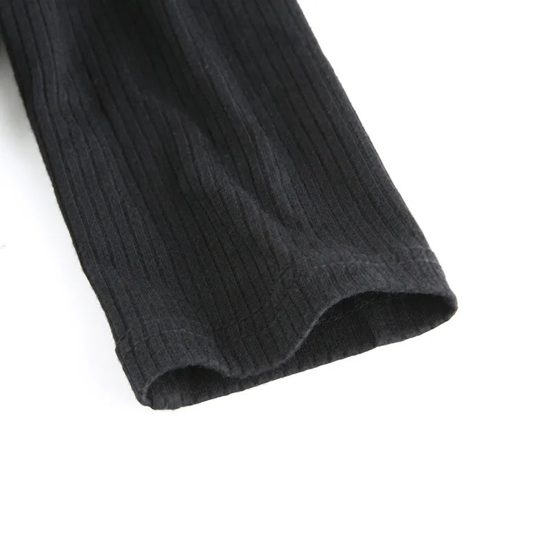 Black ribbed knit long sleeve V-neck bodycon mini dress with ruffle hem