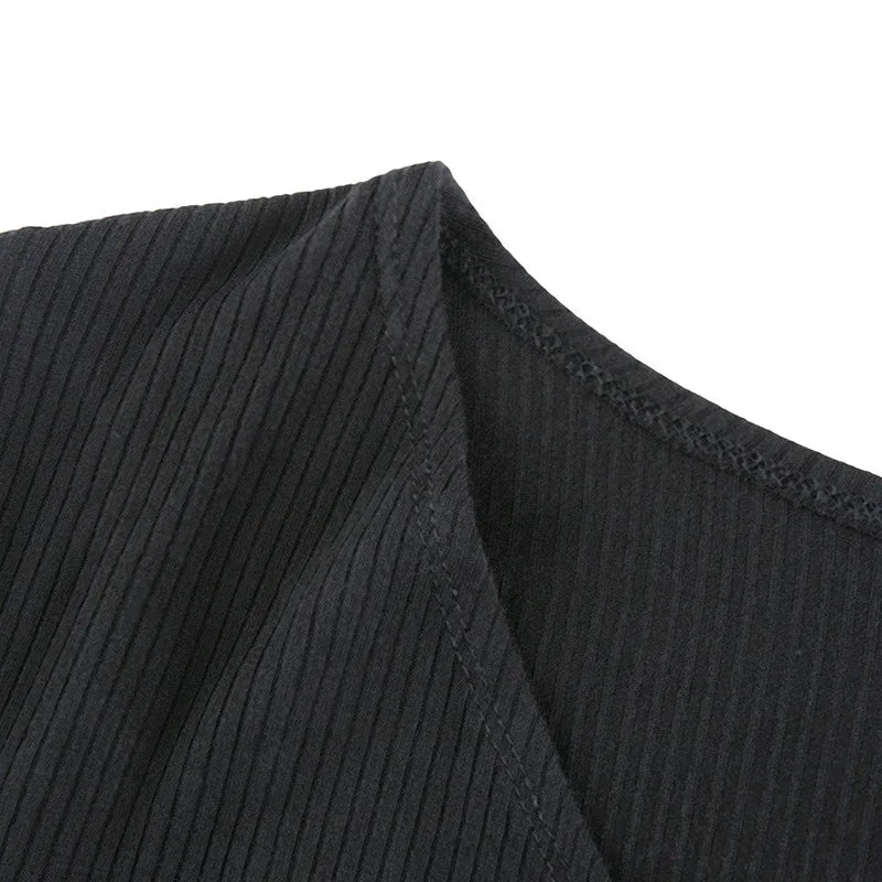 Black ribbed knit long sleeve V-neck bodycon mini dress with ruffle hem 