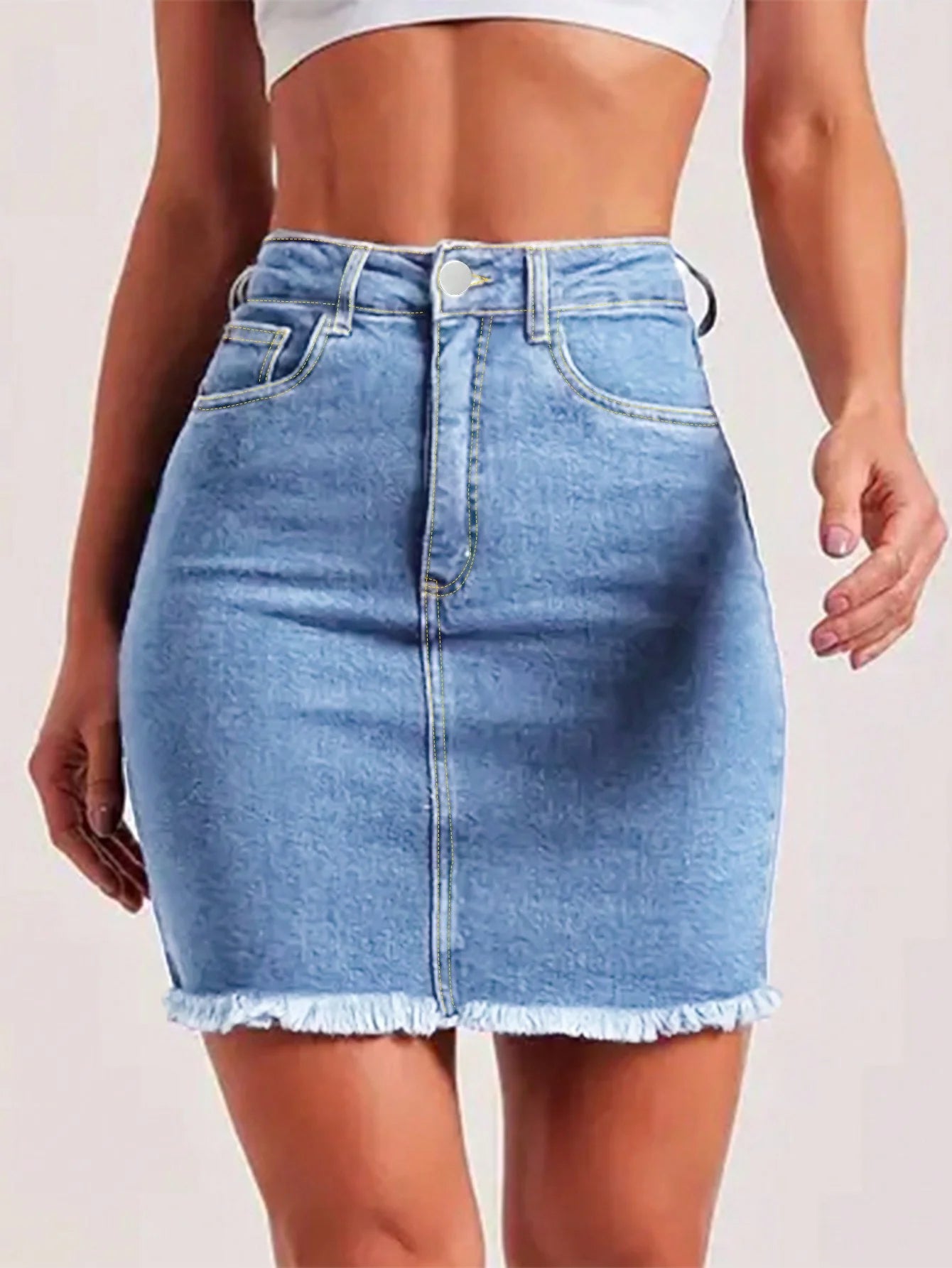 Light blue women’s denim mini skirt with raw hem, button closure, and front pockets – slim fit stretchy summer jeans skirt